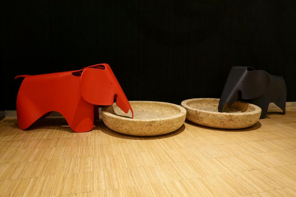 A red elephant on an empty table