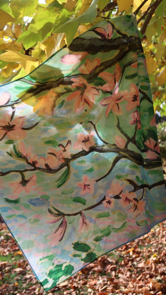 The Magic Scarf evokes sakura in spring, inspired by impressionist Erin Hanson, with gold and green hues reflecting the unique colours of Otago. 